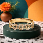 Aarvika Golden Clover Wave Bracelet – flat lay