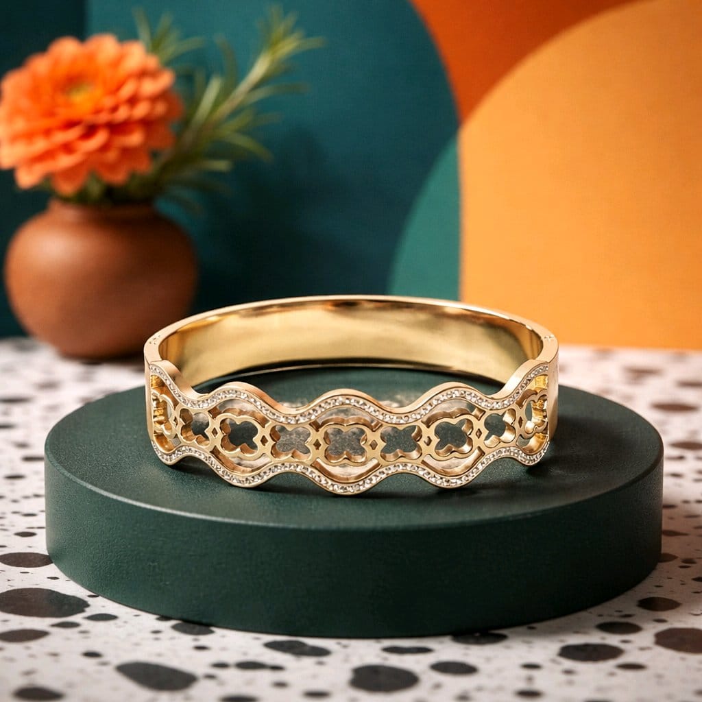 Aarvika Golden Clover Wave Bracelet – flat lay