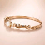 Aarvika Rose Gold Clover Wave Bracelet – flat lay