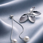 Aarvika Silver Leaf Pearl Drop Earrings – model wearing