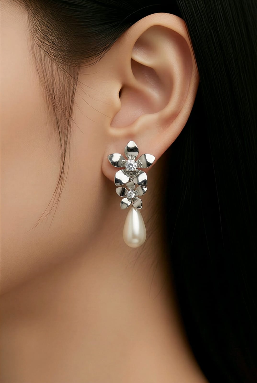Aarvika Silver Floral Pearl Drop Earrings – model wearing