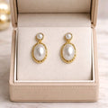 Aarvika Gold Oval Pearl Drop Earrings – front view