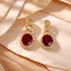 Aarvika CZ Crystal Gold Ruby Red Stone Drop Earrings – flat lay