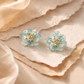 Aarvika CZ Crystal Sky-blue Floral Stud Earrings – front view