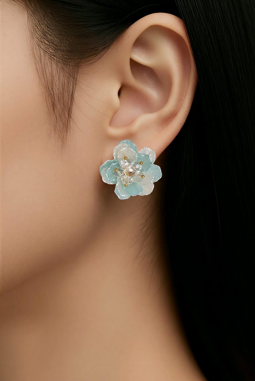 Aarvika CZ Crystal Sky-blue Floral Stud Earrings – model wearing