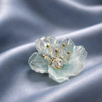 Aarvika CZ Crystal Sky-blue Floral Stud Earrings – flat lay