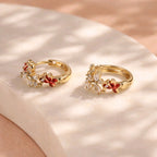 Aarvika CZ Crystal Gold Floral CZ Huggie Hoop Earrings – front view