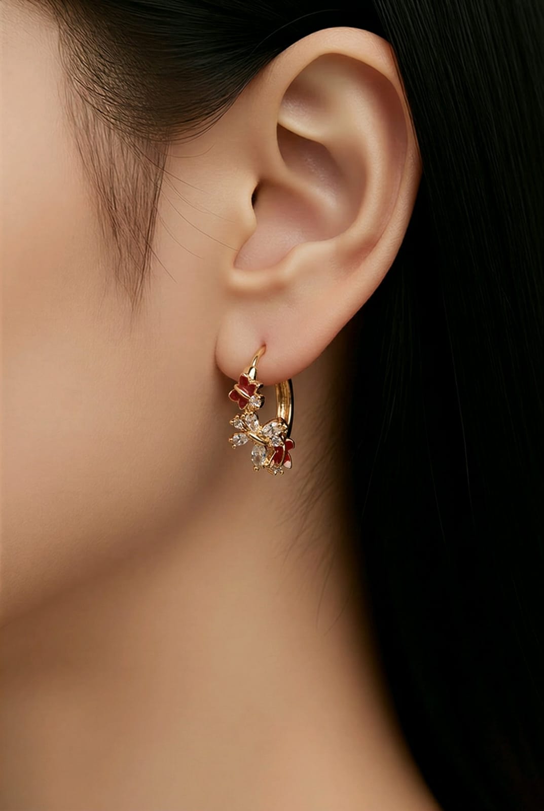 Aarvika CZ Crystal Gold Floral CZ Huggie Hoop Earrings – model wearing