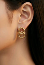 Aarvika Gold Interlinked Knot Stud Earrings – model wearing