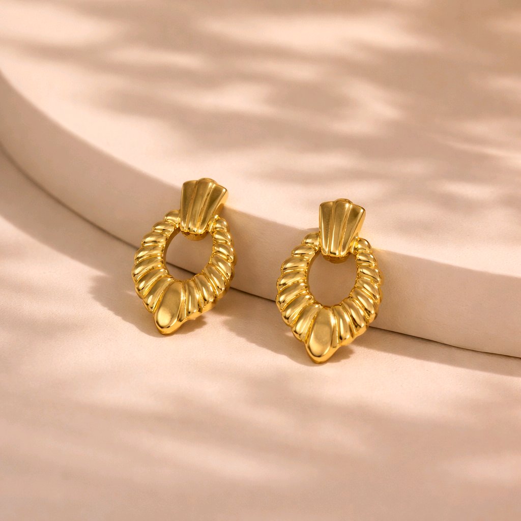 Aarvika Gold Textured Heart Drop Earrings – flat lay