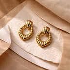 Aarvika Gold Textured Heart Drop Earrings – model wearing