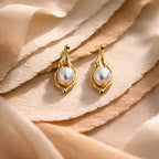 Aarvika Gold Abstract Pearl Drop Earrings – flat lay