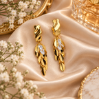 Aarvika Gold Tone Leaf Drop Earrings with Clear Crystal Accents
