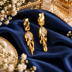 Aarvika Gold Tone Leaf Drop Earrings with Clear Crystal Accents