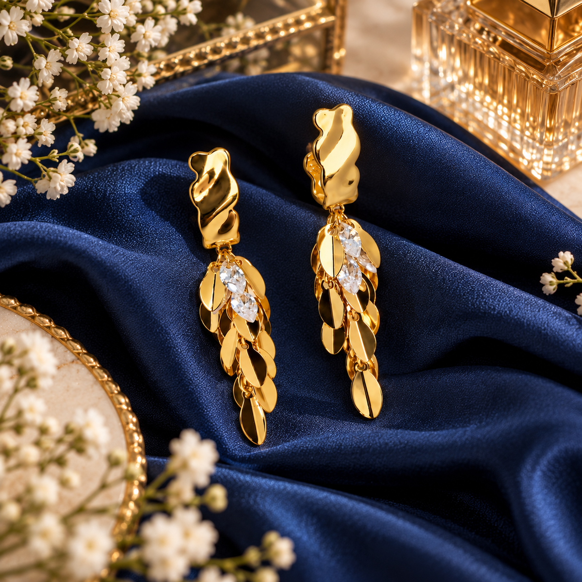 Aarvika Gold Tone Leaf Drop Earrings with Clear Crystal Accents