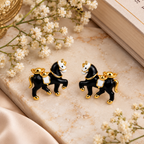 Aarvika Black Horse Stud Earrings with Gold Tone Detailing