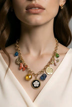 Aarvika Gold-Plated Luxe Multi-Charm Statement Necklace – flat lay