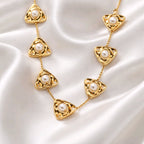 Aarvika Luxe Golden Pearl Triangle Statement Necklace – flat lay