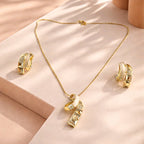 Aarvika Premium Luxe Ribbon Pendant Necklace & Earrings Set – flat lay