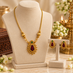Aarvika Gold-Tone Traditional Necklace Set with Red Green Stones