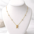 Aarvika CZ Crystal 22K Gold-Plated Crystal Ribbon Pendant Necklace – close-up detail