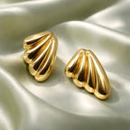 Aarvika Gold Wave Stud Earrings – model wearing