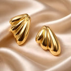 Aarvika Gold Wave Stud Earrings – front view