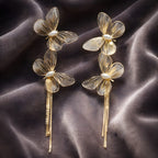 Aarvika Golden Butterfly Tassel Drops – flat lay