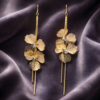 Aarvika Golden Floral Long Drops – model wearing