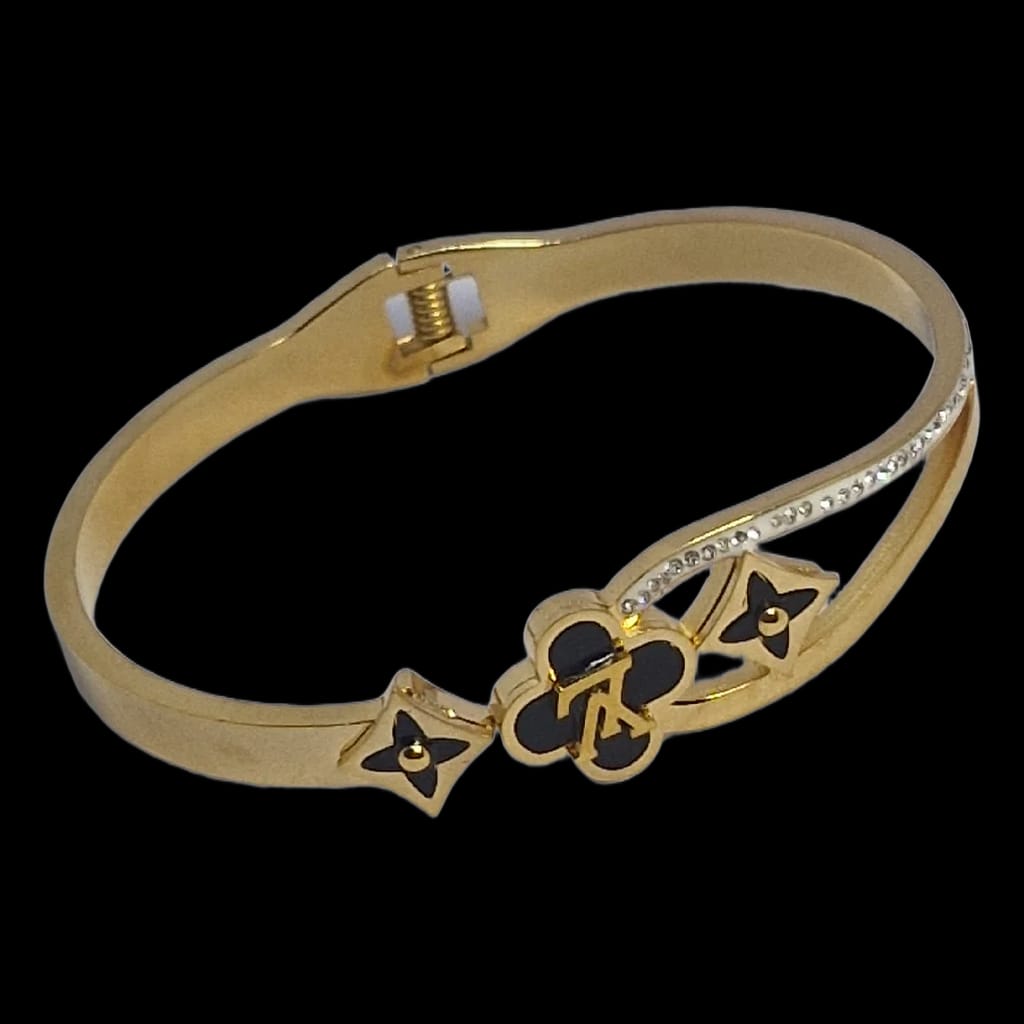 Aarvika Golden Black Charm Bracelet – flat lay