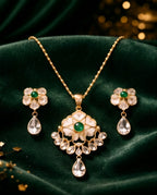 Aarvika Emerald Stone 18K Gold-Plated Emerald Floral Pendant Set with Ethnic – detail shot