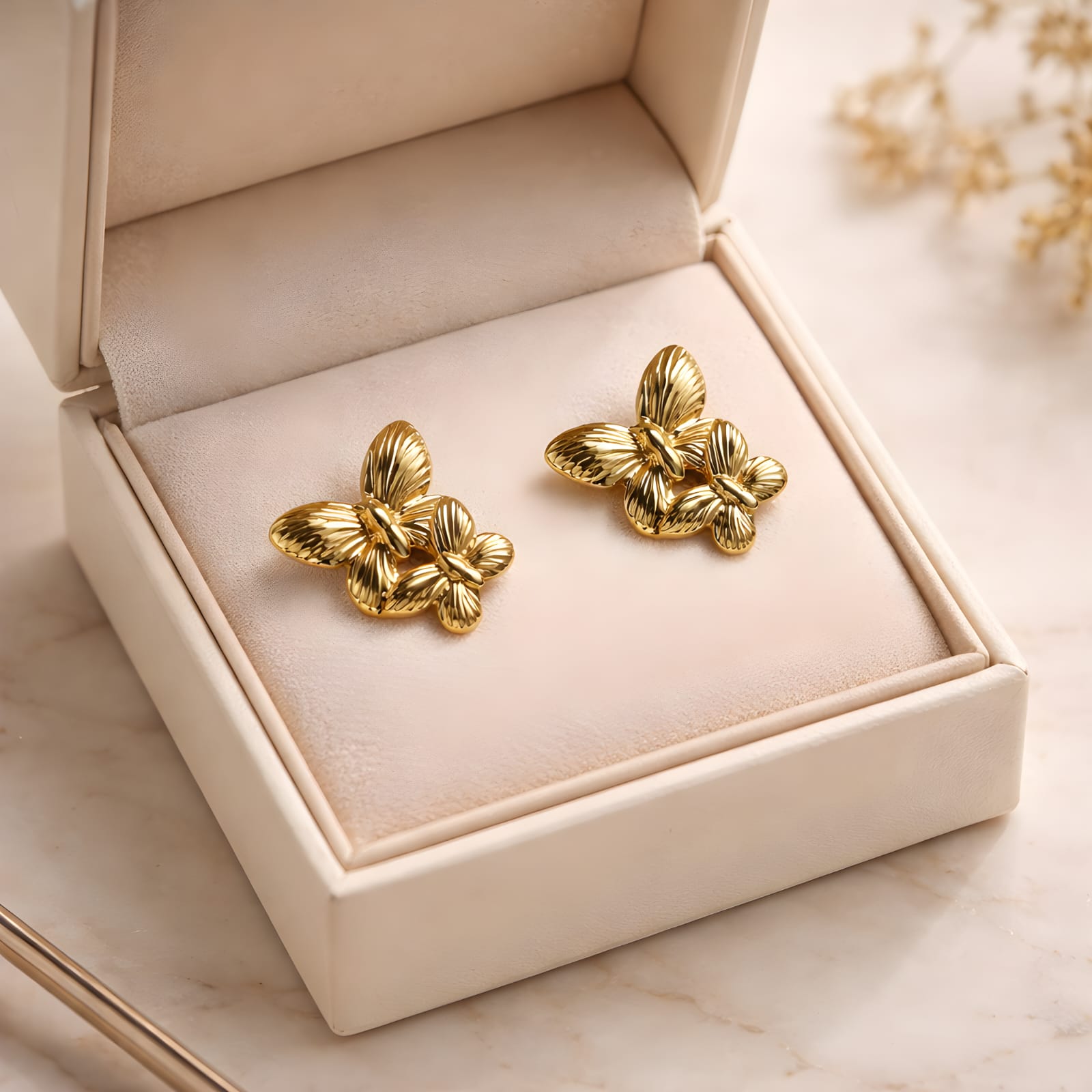 Aarvika Golden Butterfly Studs – flat lay